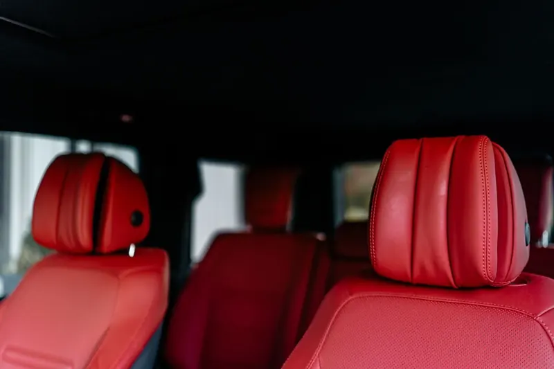 Red leather front seats in a clean cabin