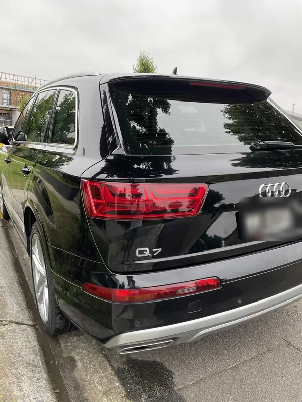 Rear of a black Audi Q7 parked on the street