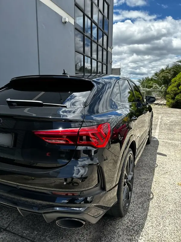Rear of the black RS Q3 in a car park