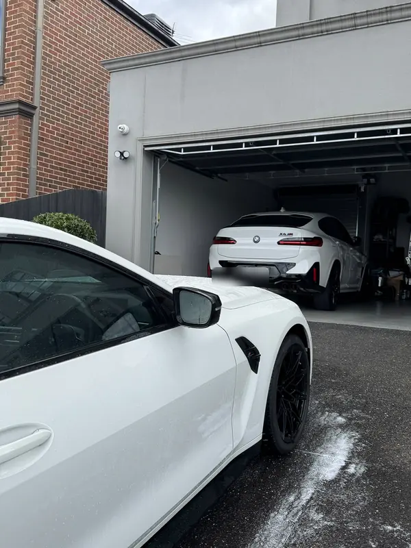 Driver door of the white M4 beaded with water after the wash