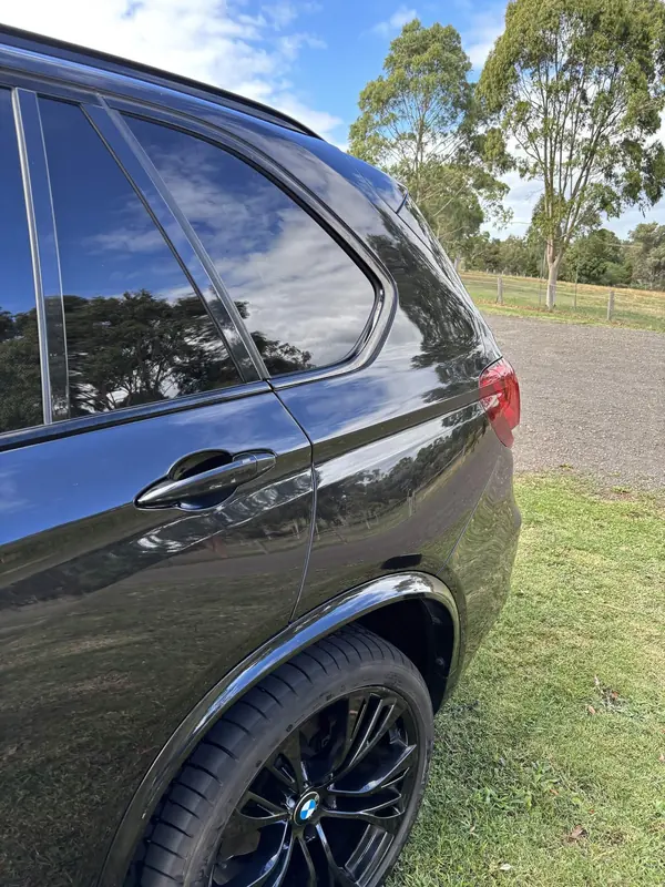 Rear door and wheel of the black X5