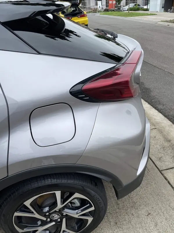 Rear quarter and tail light of the silver C-HR