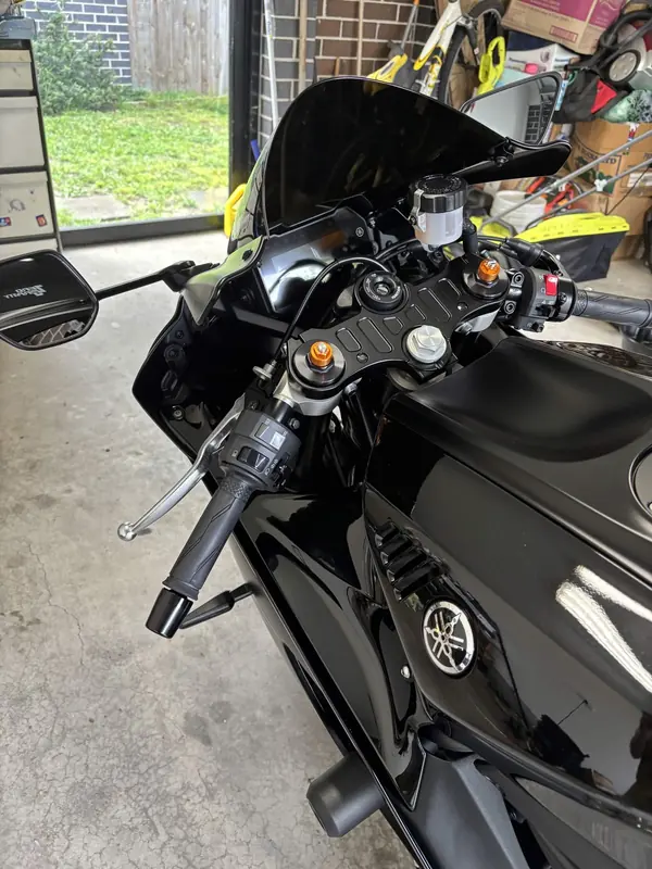 Black Yamaha R7 in a garage, cockpit view