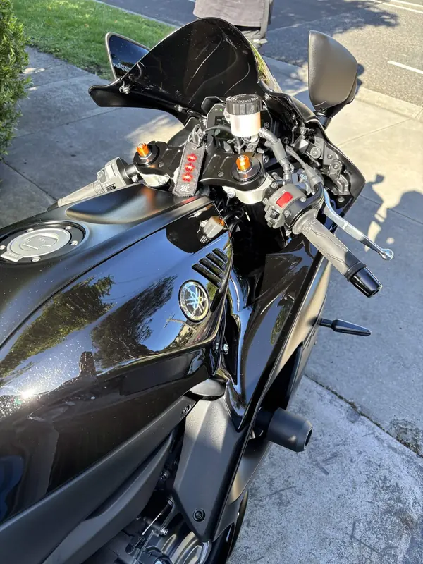 Black Yamaha R7 on a driveway, from above